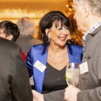 President Philomena Mantella greeting guests at receptoin